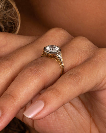 Vintage gold diamond ring worn on a hand