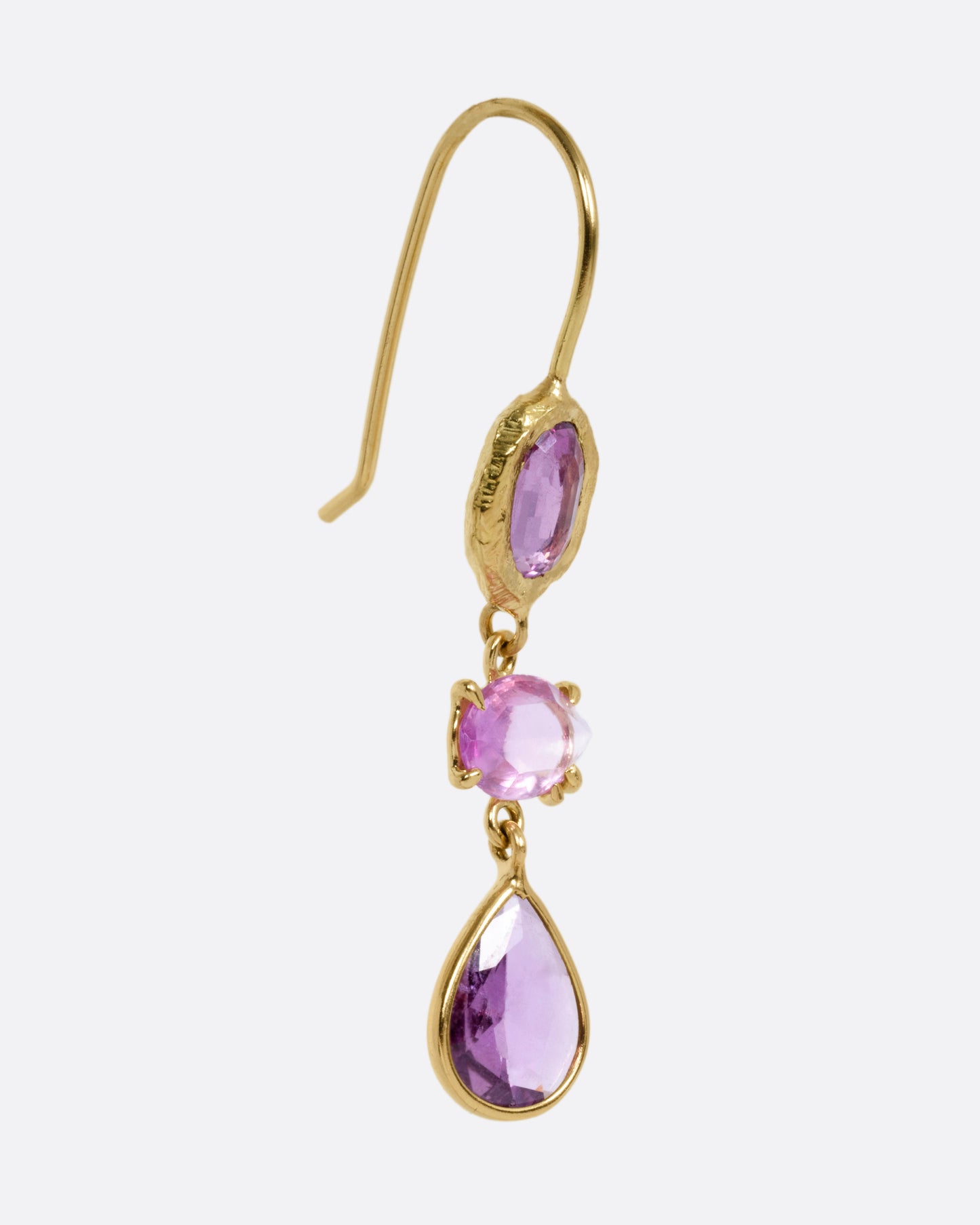 A yellow gold earring with three pink sapphires, shown from the front.