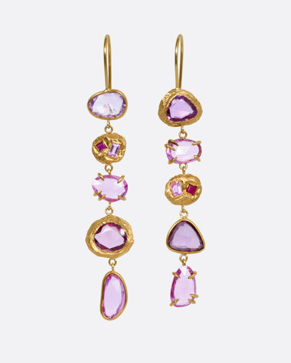 A pair of yellow gold drop earrings with pink sapphires and ruby and diamond accents, shown from the front.