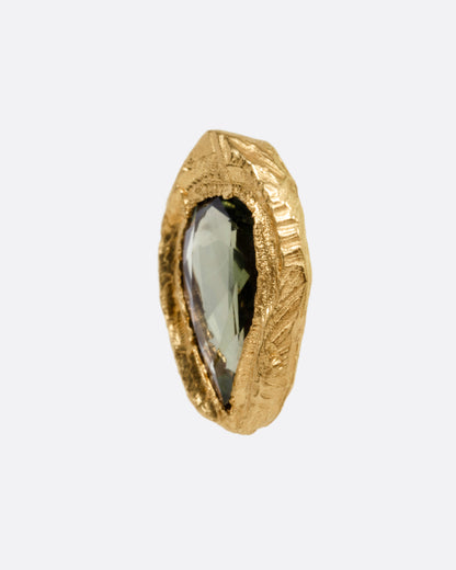 Yellow gold green sapphire stud earrings, close side view of one stud