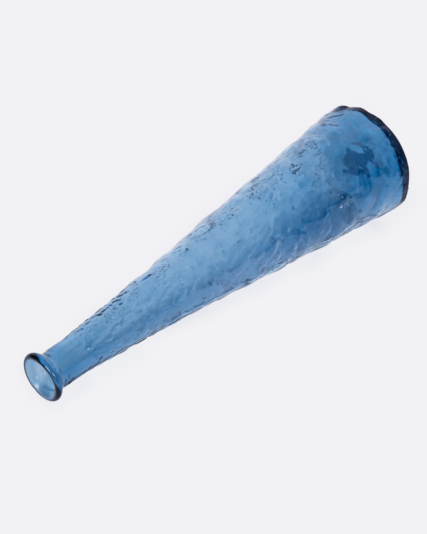 A tall tapered blue glass vase with a textured exterior, shown from the side.