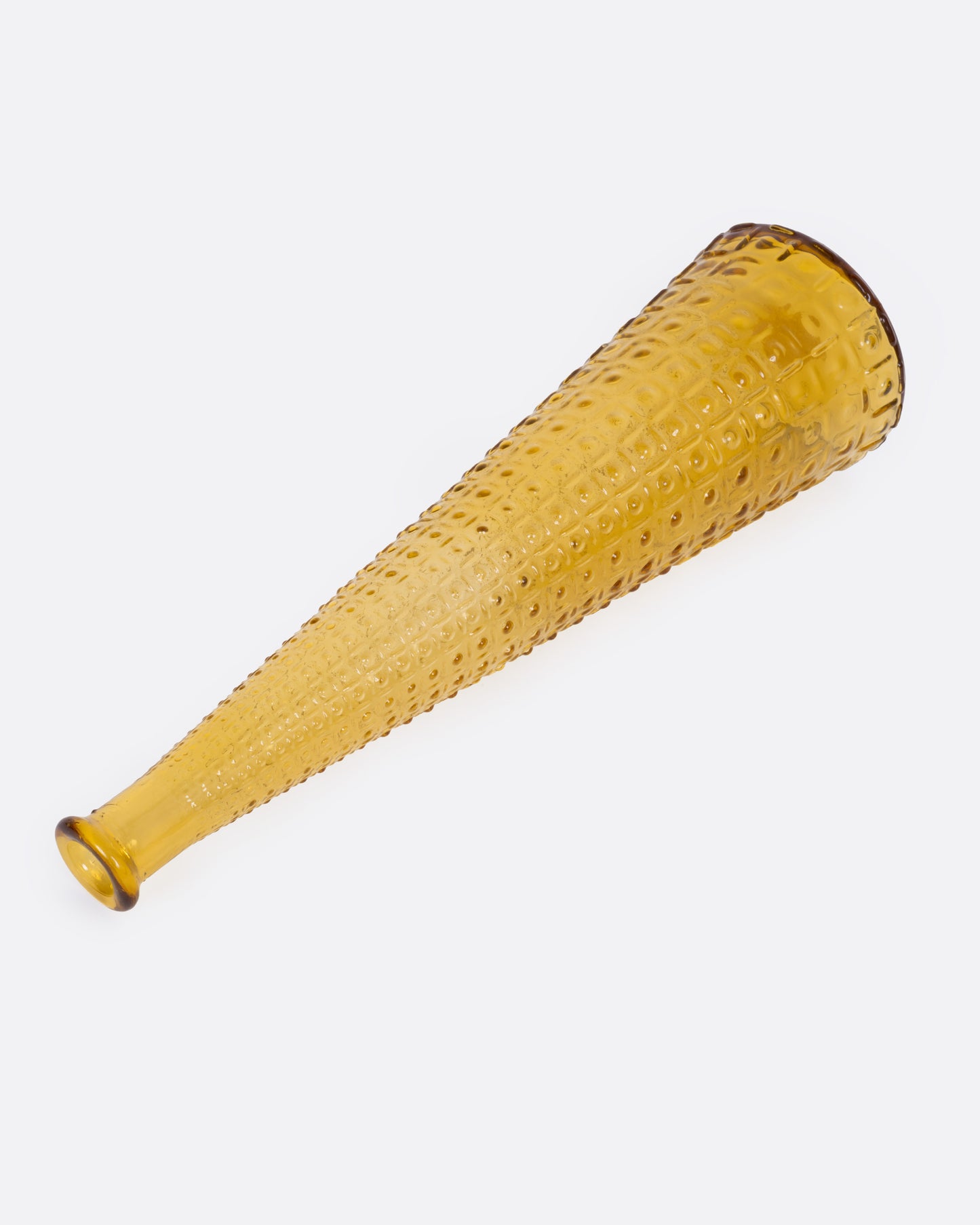 A tall tapered amber glass vase with an Aztec Hobnail exterior, shown from the side.