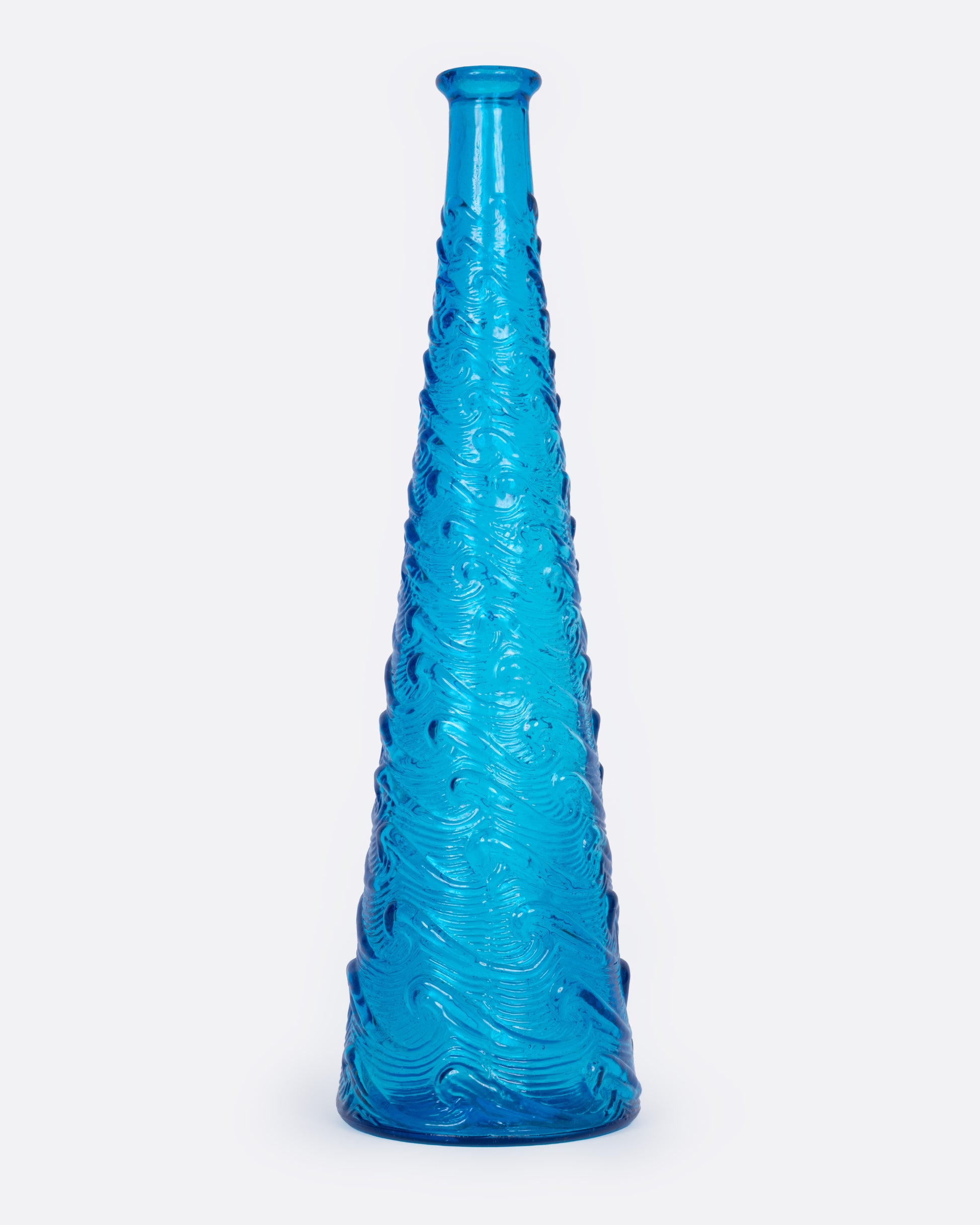 A tall tapered cerulean glass vase with a wavy textured exterior, shown from the front.