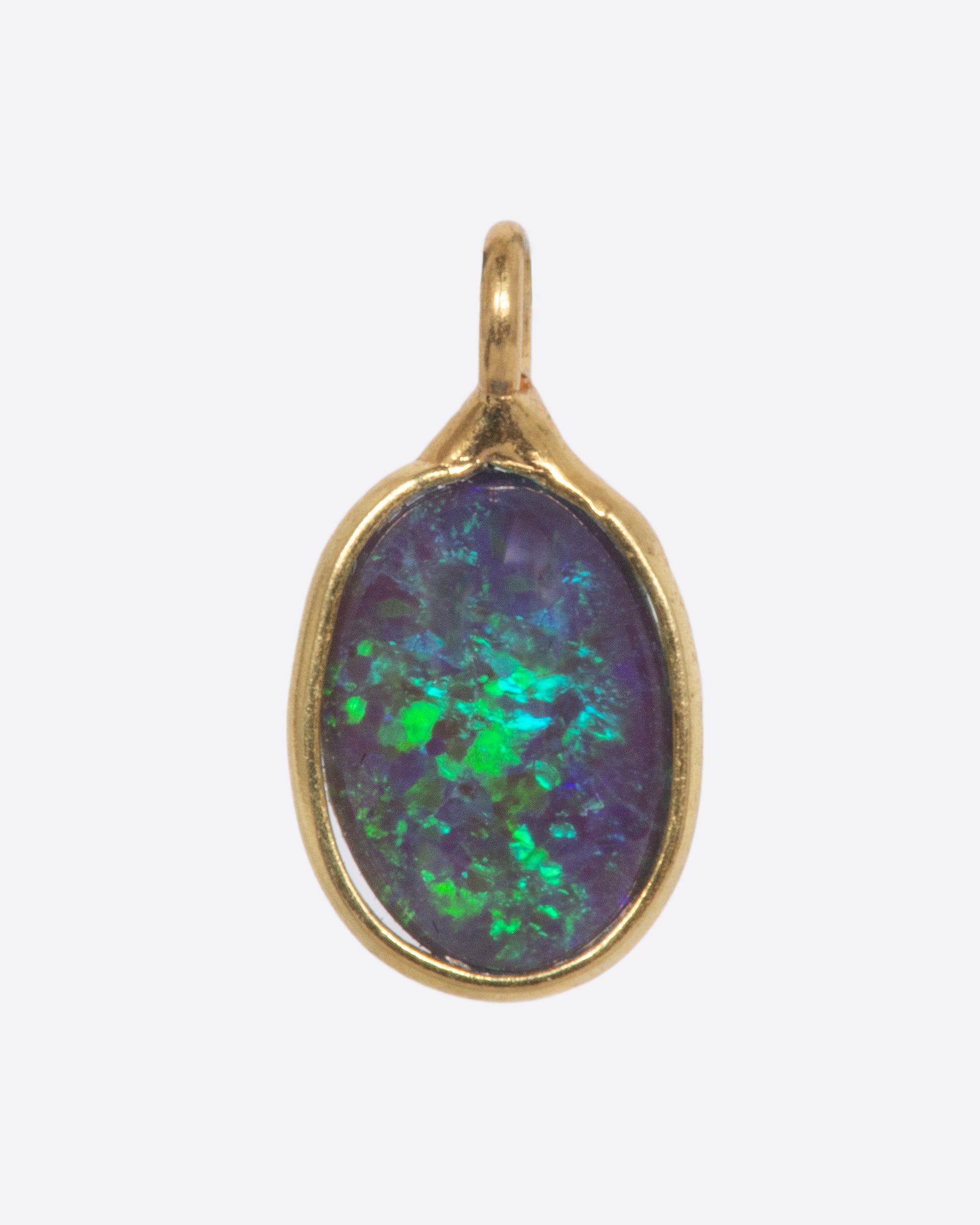 An Australian opal dangle set in yellow gold. Shown from the front.