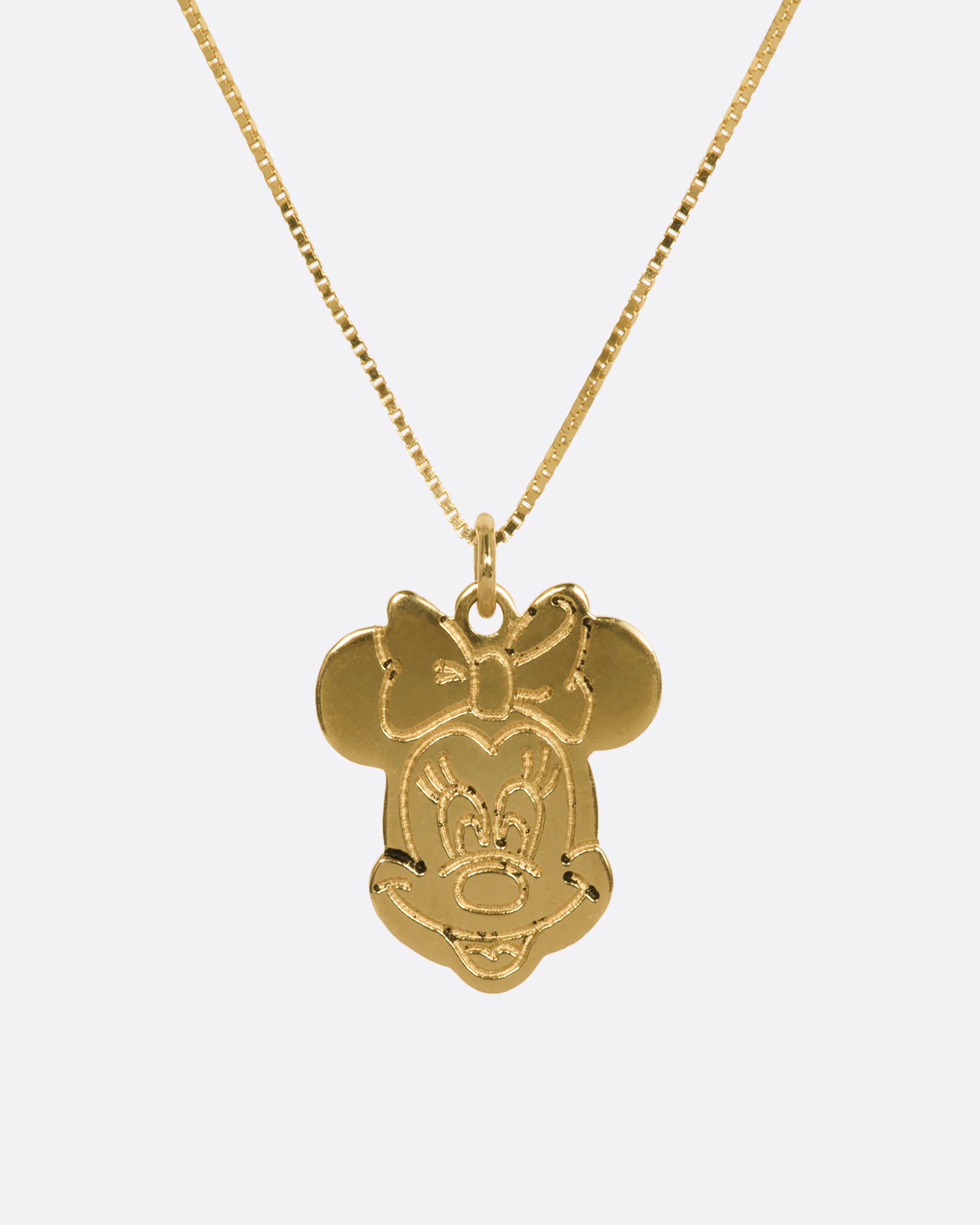 Yellow gold Minnie Mouse pendant hanging from box chain. View close up from the front.