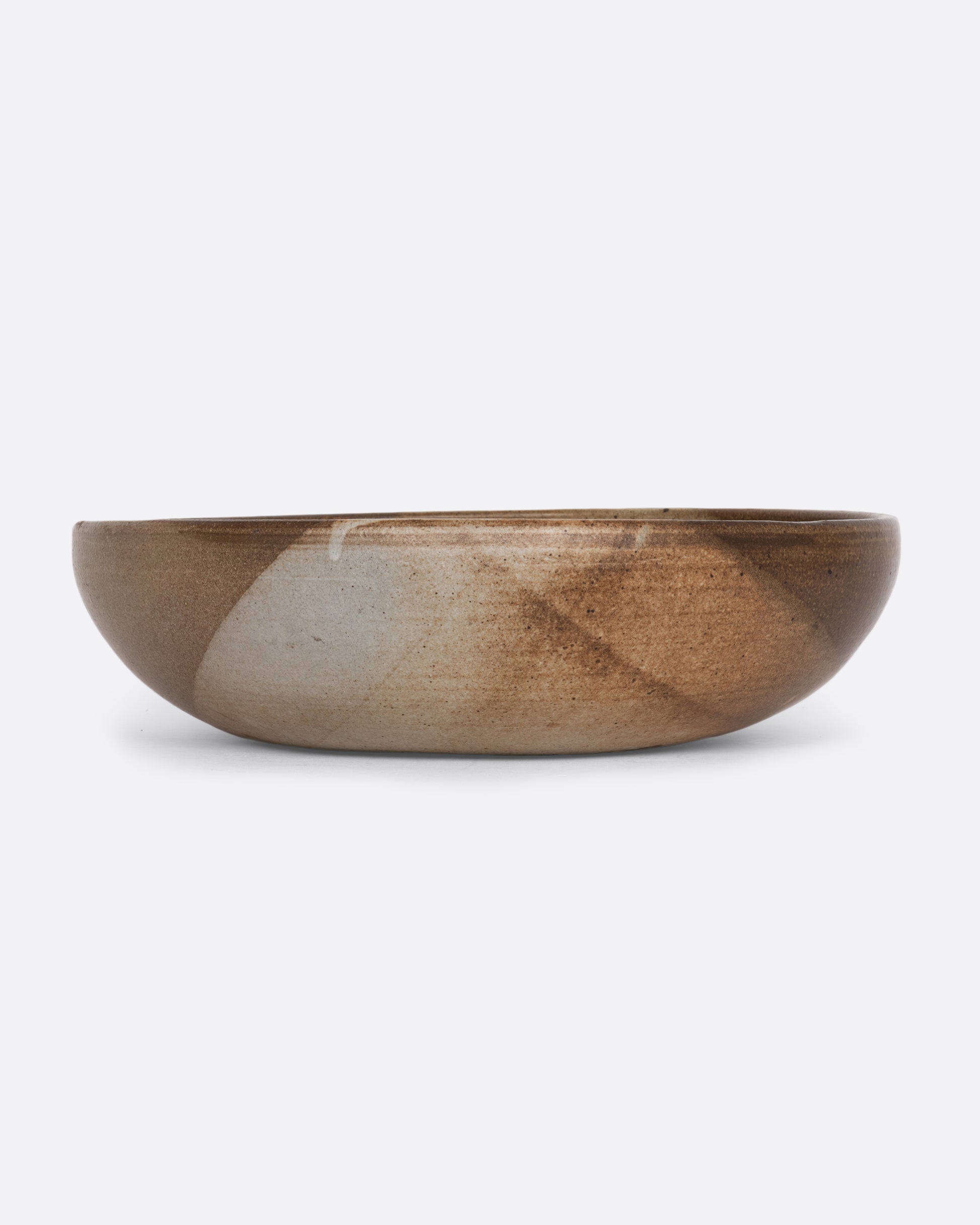 A ceramic deep bowl platter with painted abstract design on the interior. View straight on.