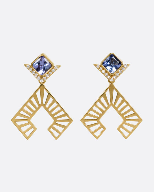 A large pair of yellow gold earrings with tanzanites and diamonds and angular cutouts, shown from the front.