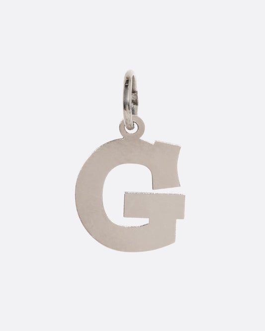 A white gold G pendant, shown from the front.