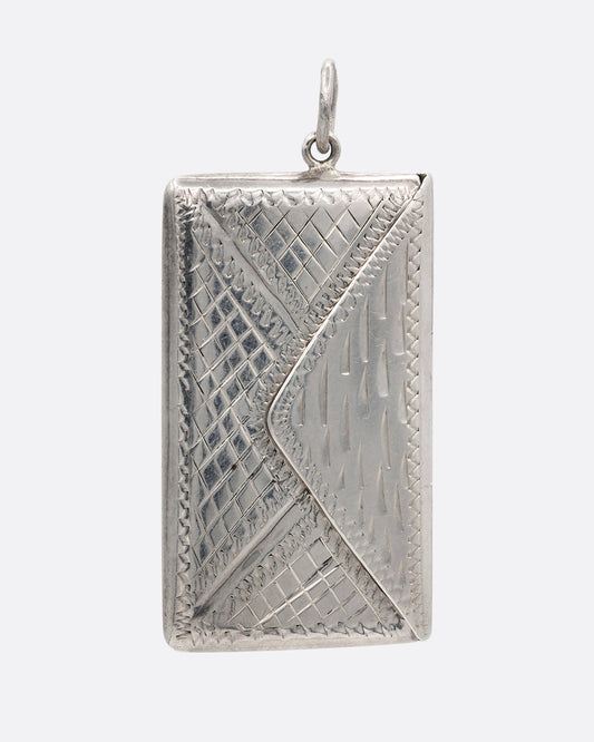 A silver textured envelope locket. Shown from the front.