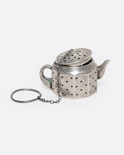 Vintage silver teapot tea infuser, angled view with the chain