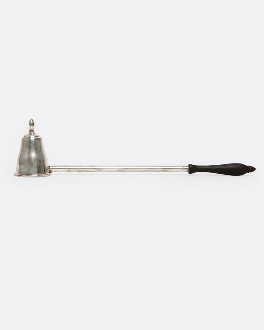 A sterling silver candle snuffer with a black wooden handle, shown from the side.