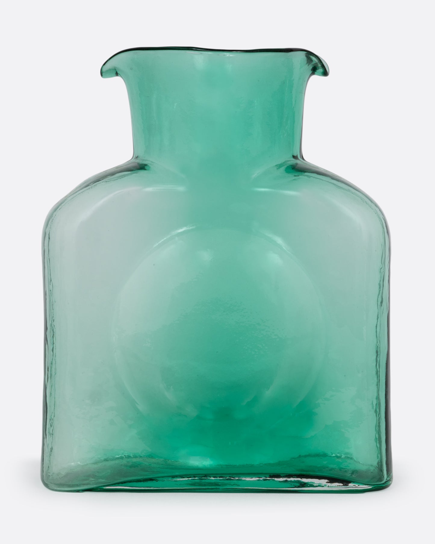 A green gradient glass double spouted 'water bottle' from Blenko. Shown from the front.