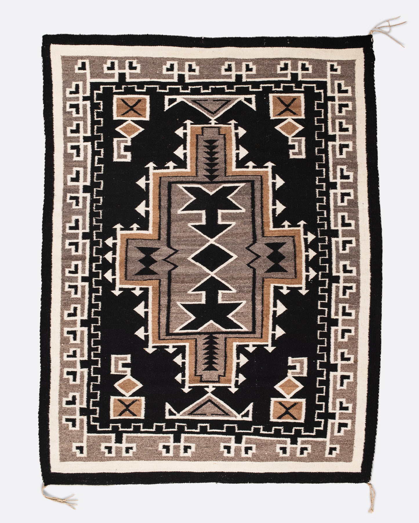 A vintage Navajo rug with the traditional Two Grey Hills weaving