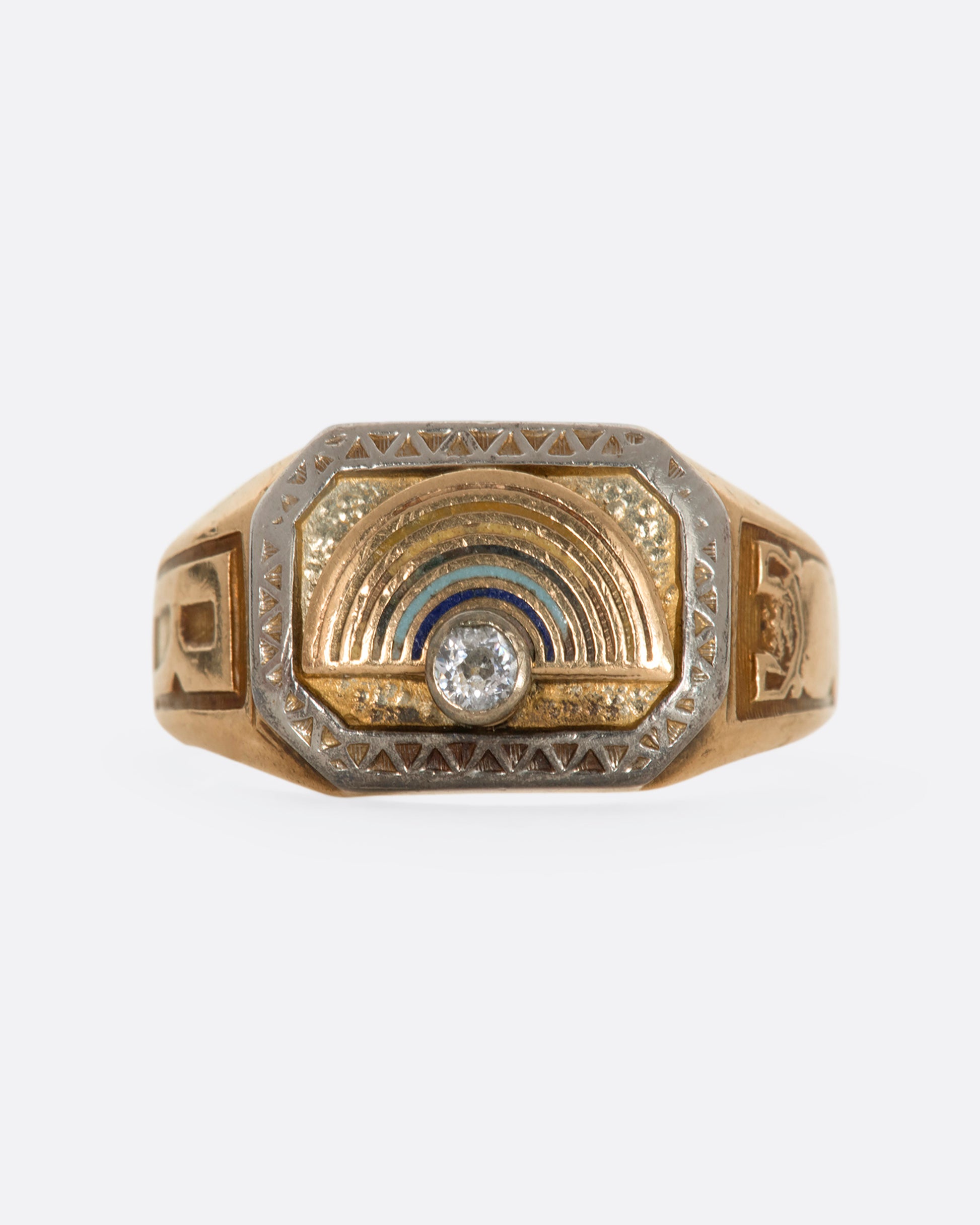 A yellow gold vintage signet ring with an arch and a round diamond on the front. View from the front.