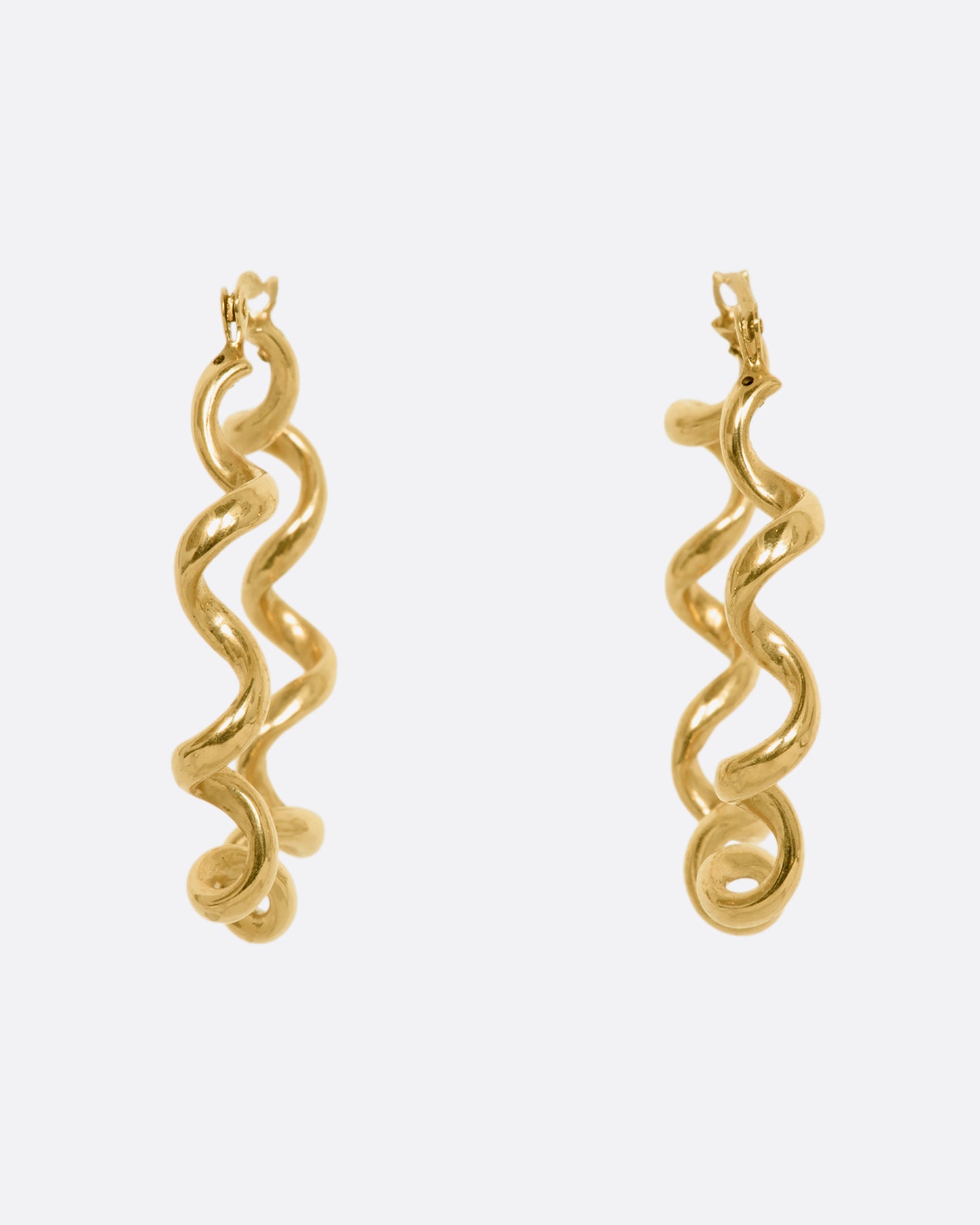 Yellow gold twisted hoop earrings. View from the front.