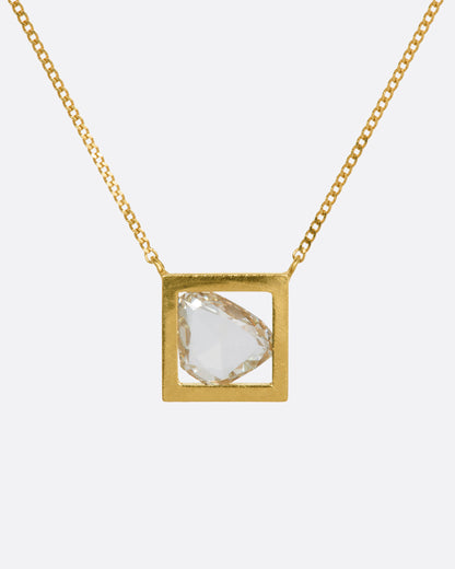 Januka Slice necklace in 18k yellow gold, a rose-cut diamond slice suspended inside an open square gold frame on a curb chain