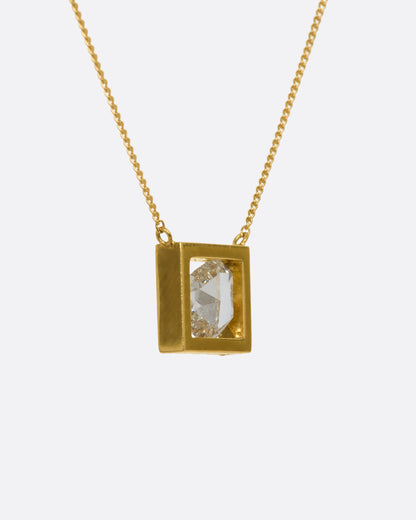 Yellow gold diamond slice necklace, side view showing the depth of the square frame