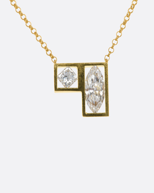 A yellow gold square and rectangle frame fixed pendant hold a marquise and a princess cut diamond hanging from a chain. View from the front.