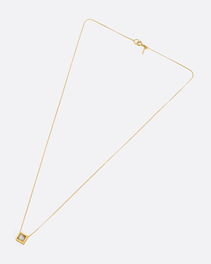 Yellow gold diamond slice necklace laid flat, showing the chain length and clasp