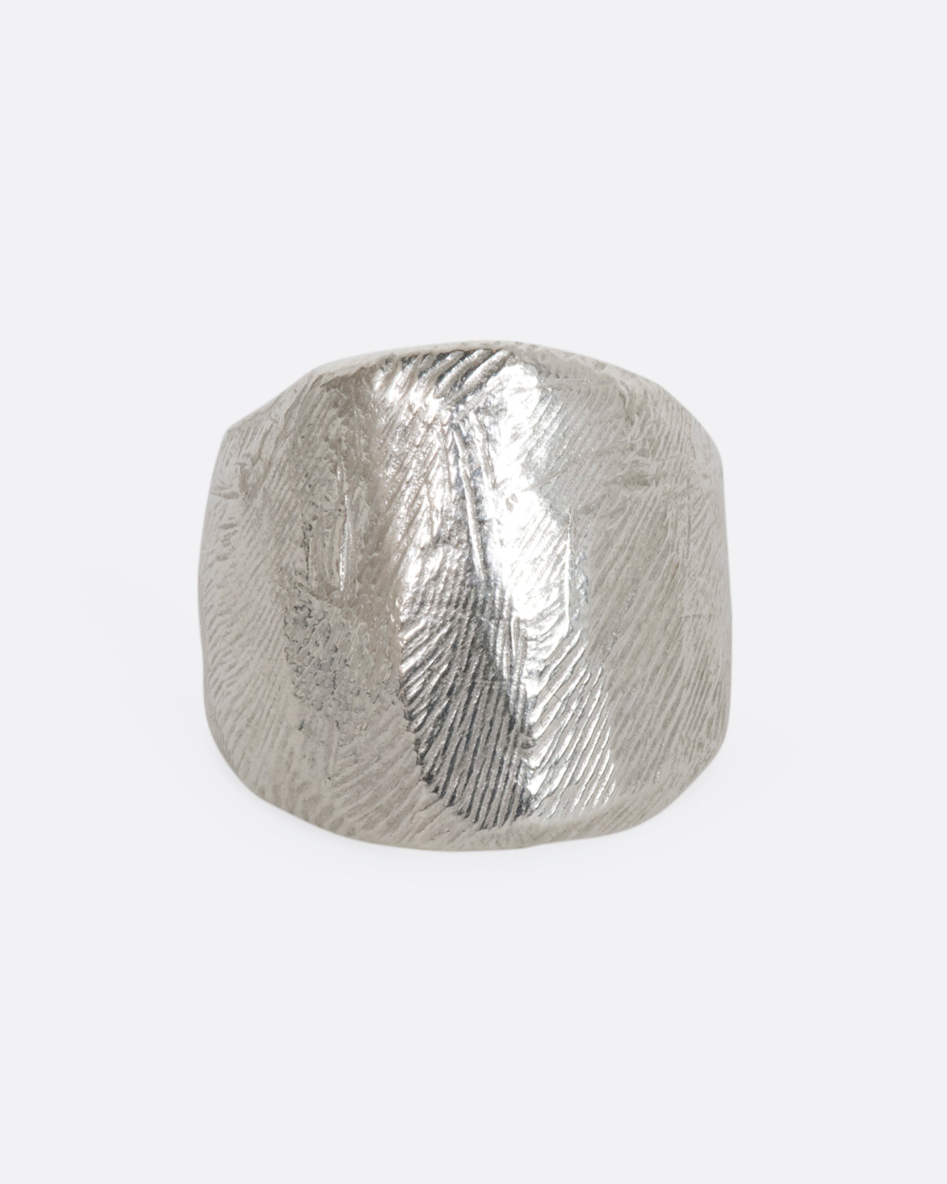 Textured sterling silver wide band ring. View from the front. 