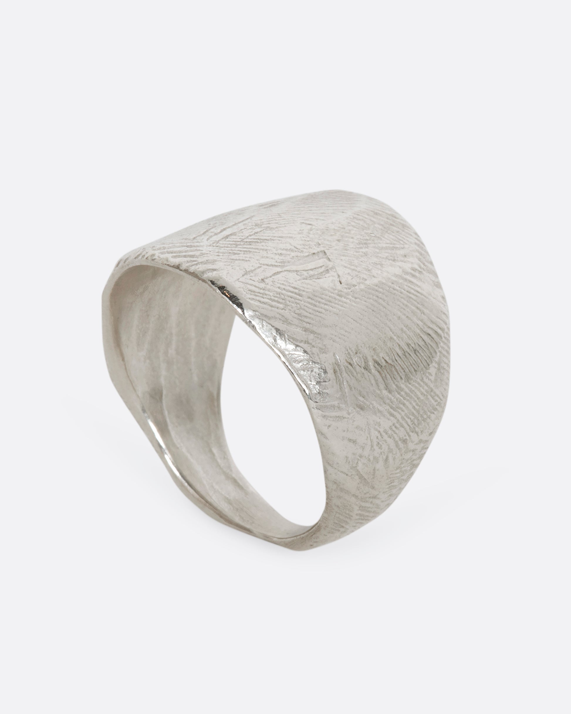 Textured sterling silver wide band ring. View standing up.