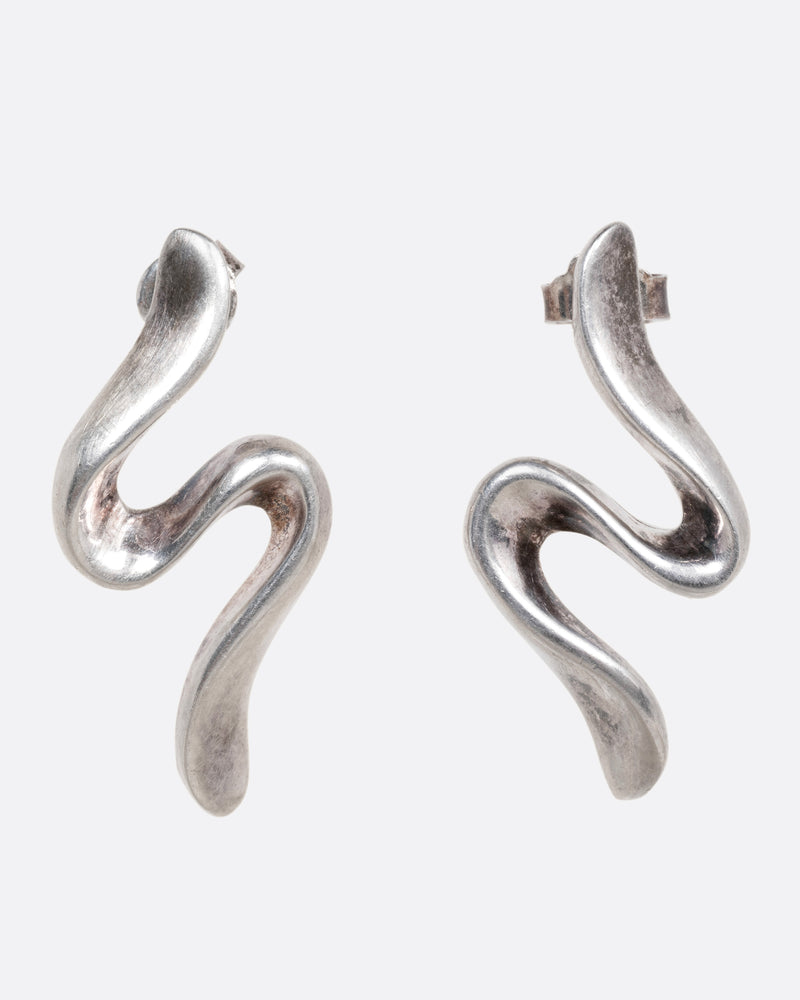 A pair of silver wavy stud earrings shown from the front.