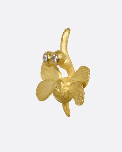A yellow gold hummingbird stud earring with diamond eyes, shown from the side.