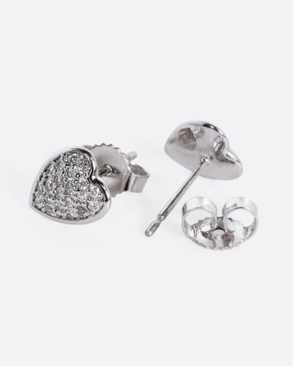 White gold pave diamond heart stud earrings, the pair laid flat showing the posts and backs