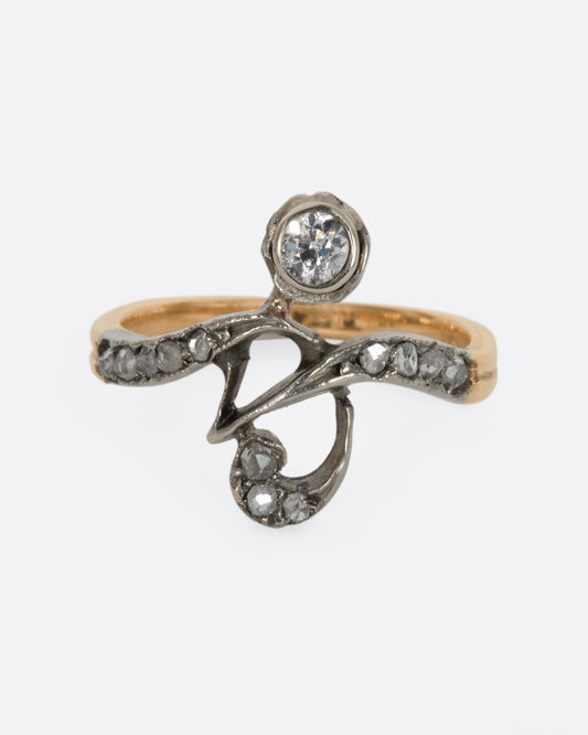 A white and rose gold diamond encrusted abstract ring. View from the front.