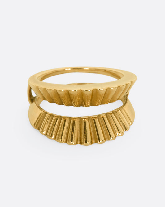 A yellow gold guard ring with a scalloped edge. Shown from the front.