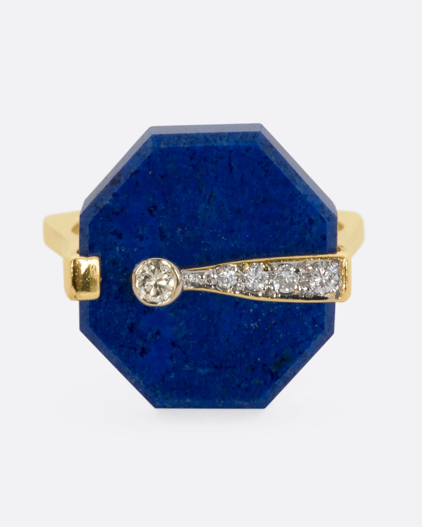 A yellow gold right with an octagonal lapis and diamond exclamation point. View straight on from the front.