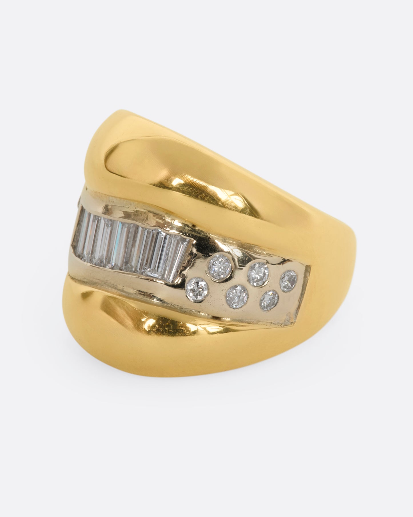 Yellow gold wide band bubble ring with baguette and round diamonds. View from the side.