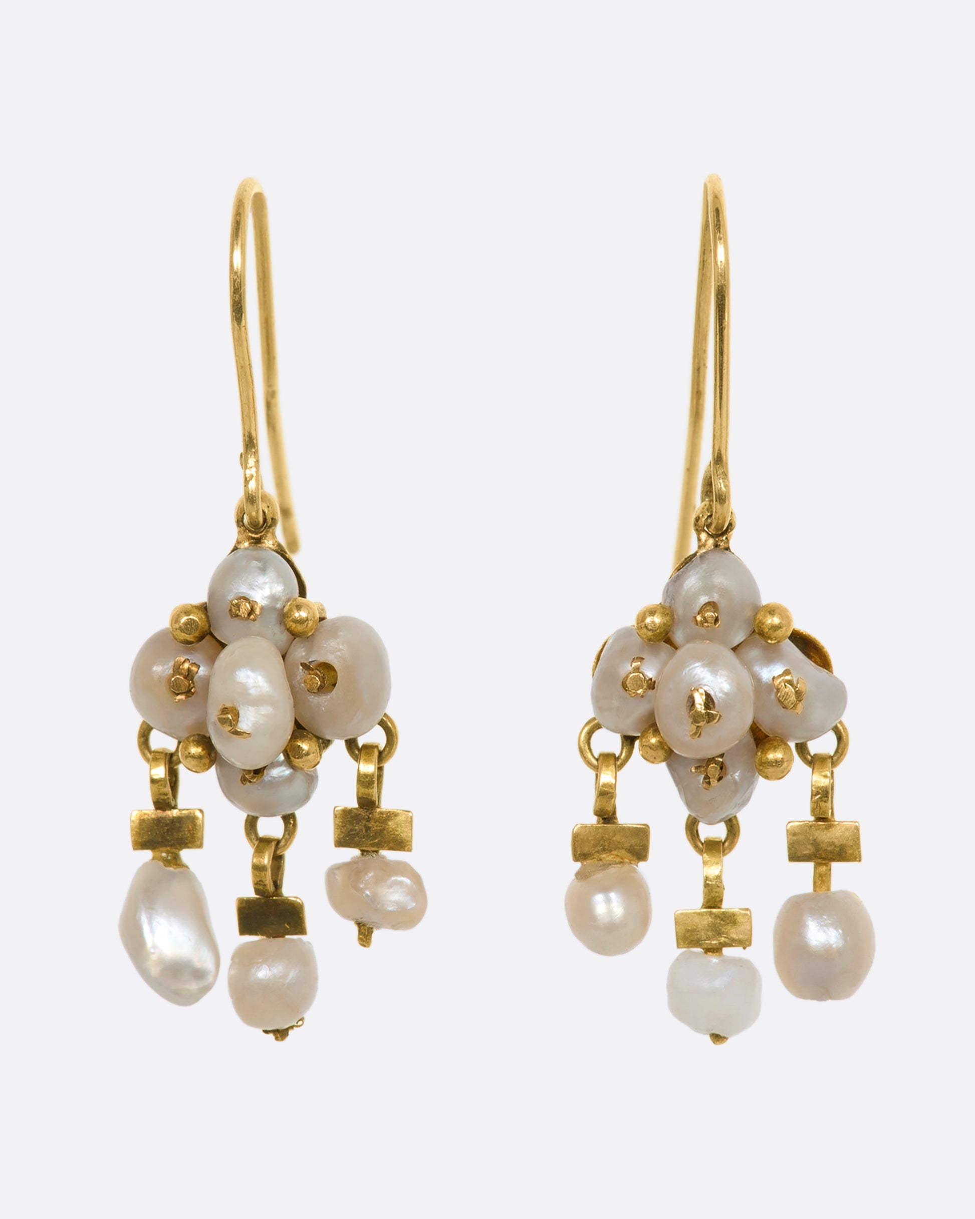 Yellow gold seed pearl chandelier drop earrings. View from the front.