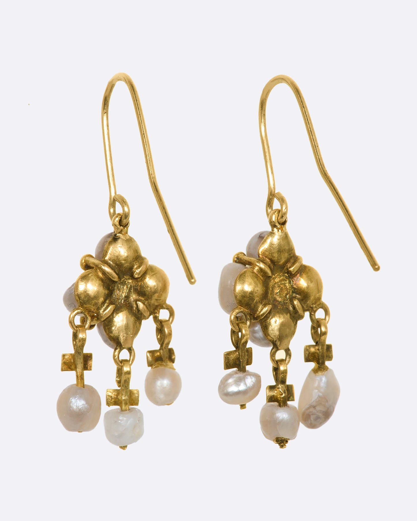 Yellow gold seed pearl chandelier drop earrings. View from the back.