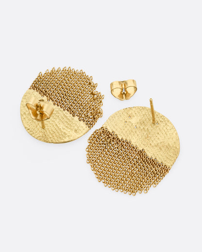 A yellow gold circular stud back earring that's half solid and half fringe chain. Shown laying flat.
