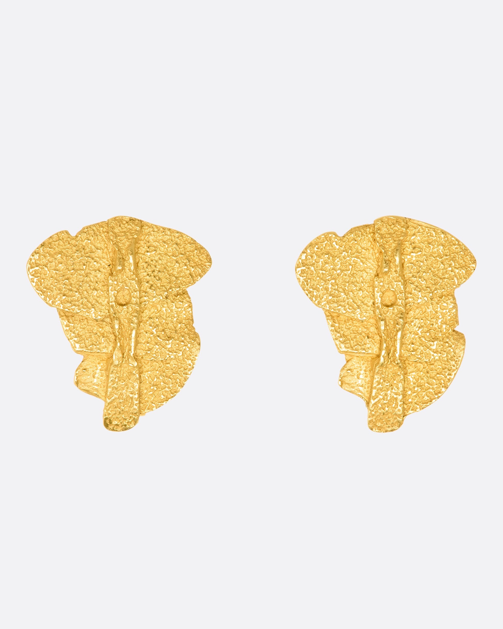 Yellow gold textured three tier clip on earrings. View from the front.