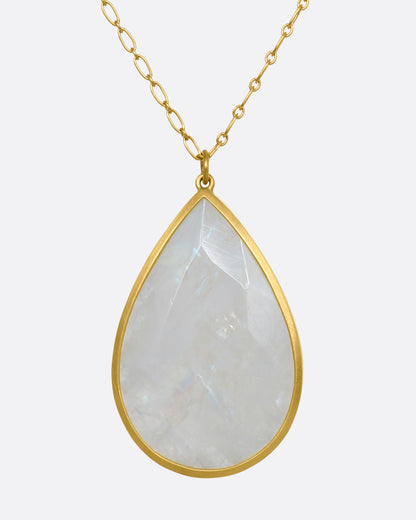Yellow gold moonstone teardrop necklace, front view of the moonstone showing its soft sheen