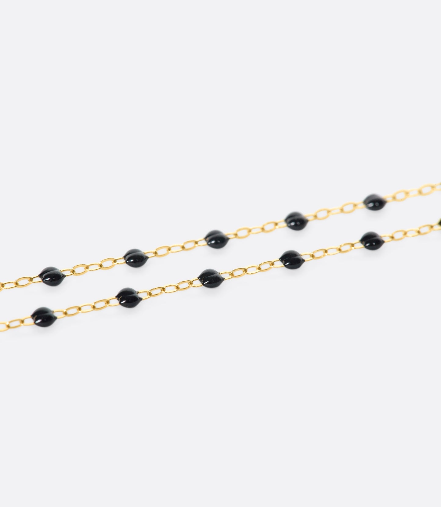 Thin 18k yellow gold chain necklace with resin beads. Each necklace is hand dipped in melted resin to create the beaded effect. 