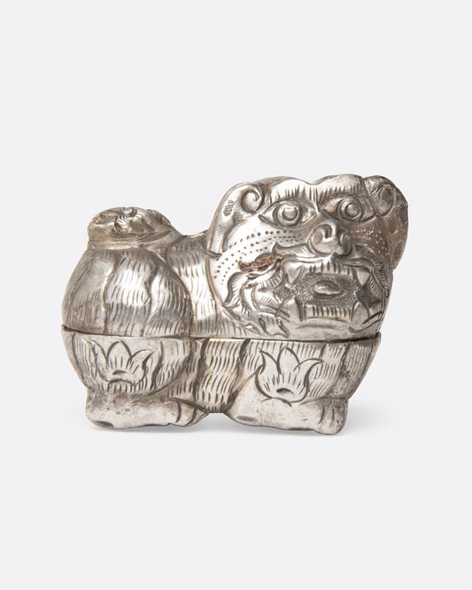 A silver guardian lion betel box shown from the front.