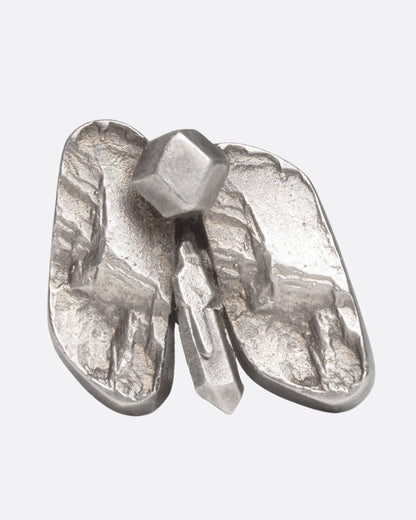 A silver abstract butterfly ring shown from the front.