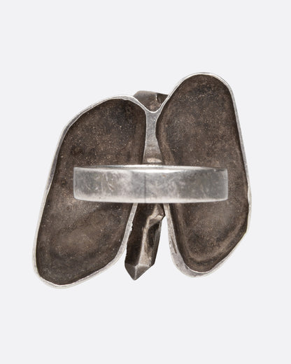 A silver abstract butterfly ring shown from the back.