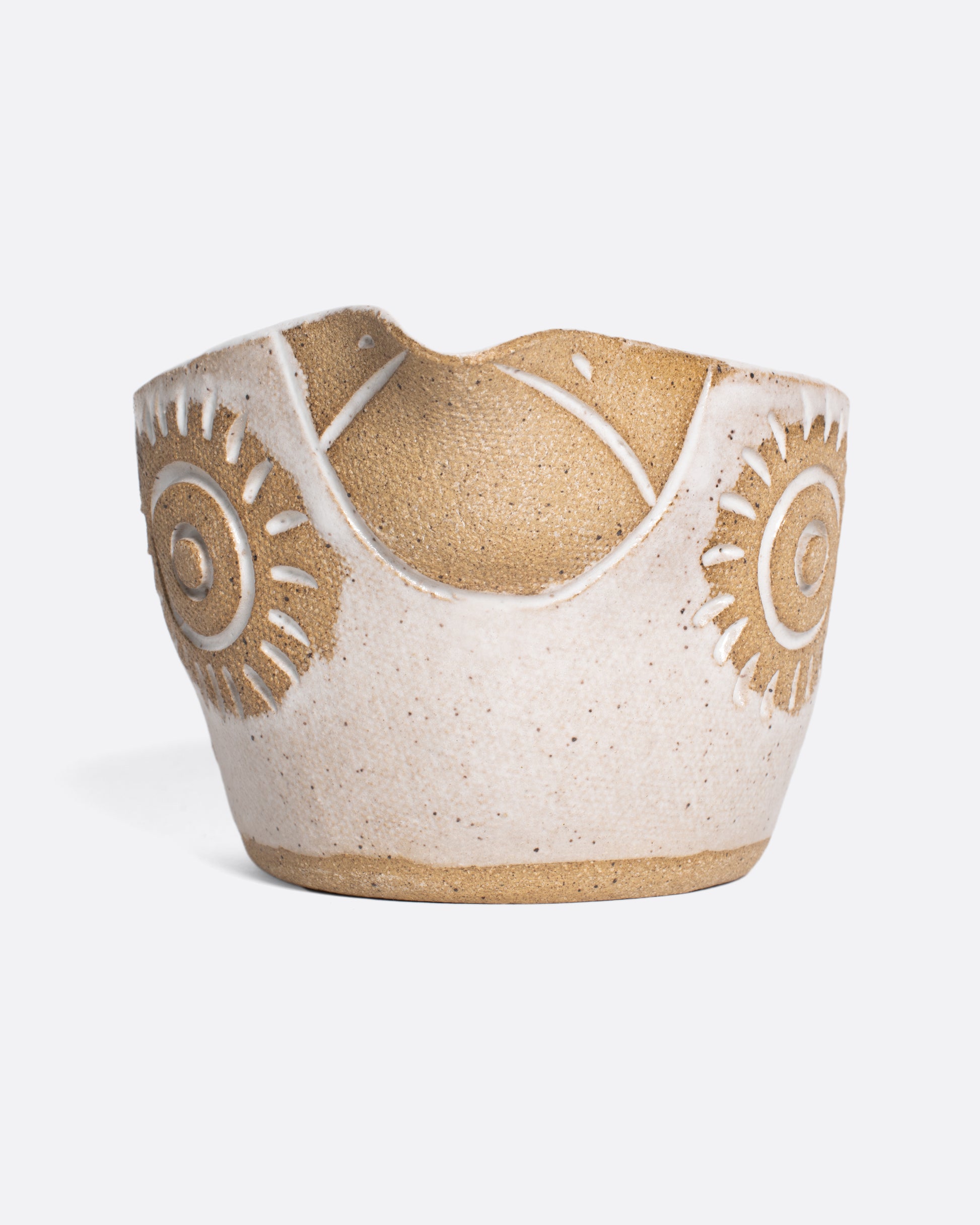 A handmade ceramic bird bowl whose beak serves as a spout, perfect for mixing and serving your favorite salad dressing.