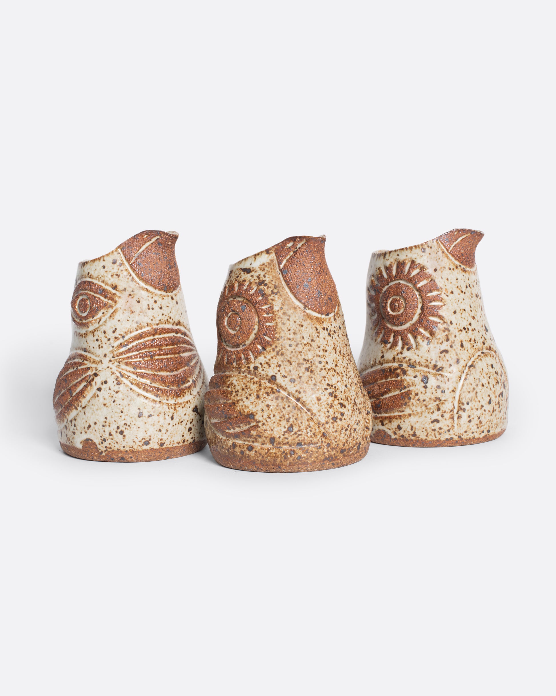 A handmade ceramic bird creamer, full of personality, with an impressionist design and speckled, satin glaze.