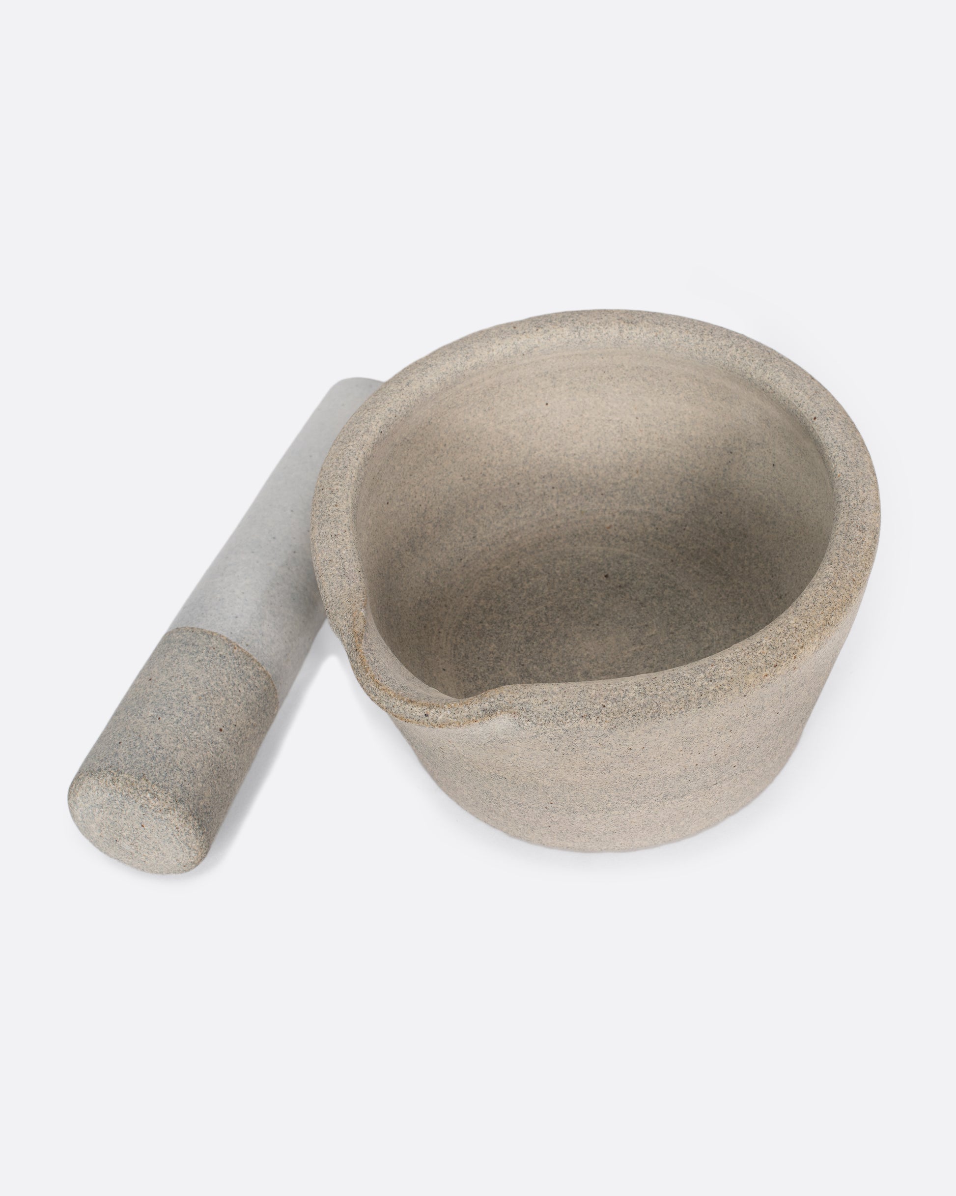 Broad-rimmed and heavy, this mortar and pestle is both beautiful and highly functional, easy to clean and stain-resistant.