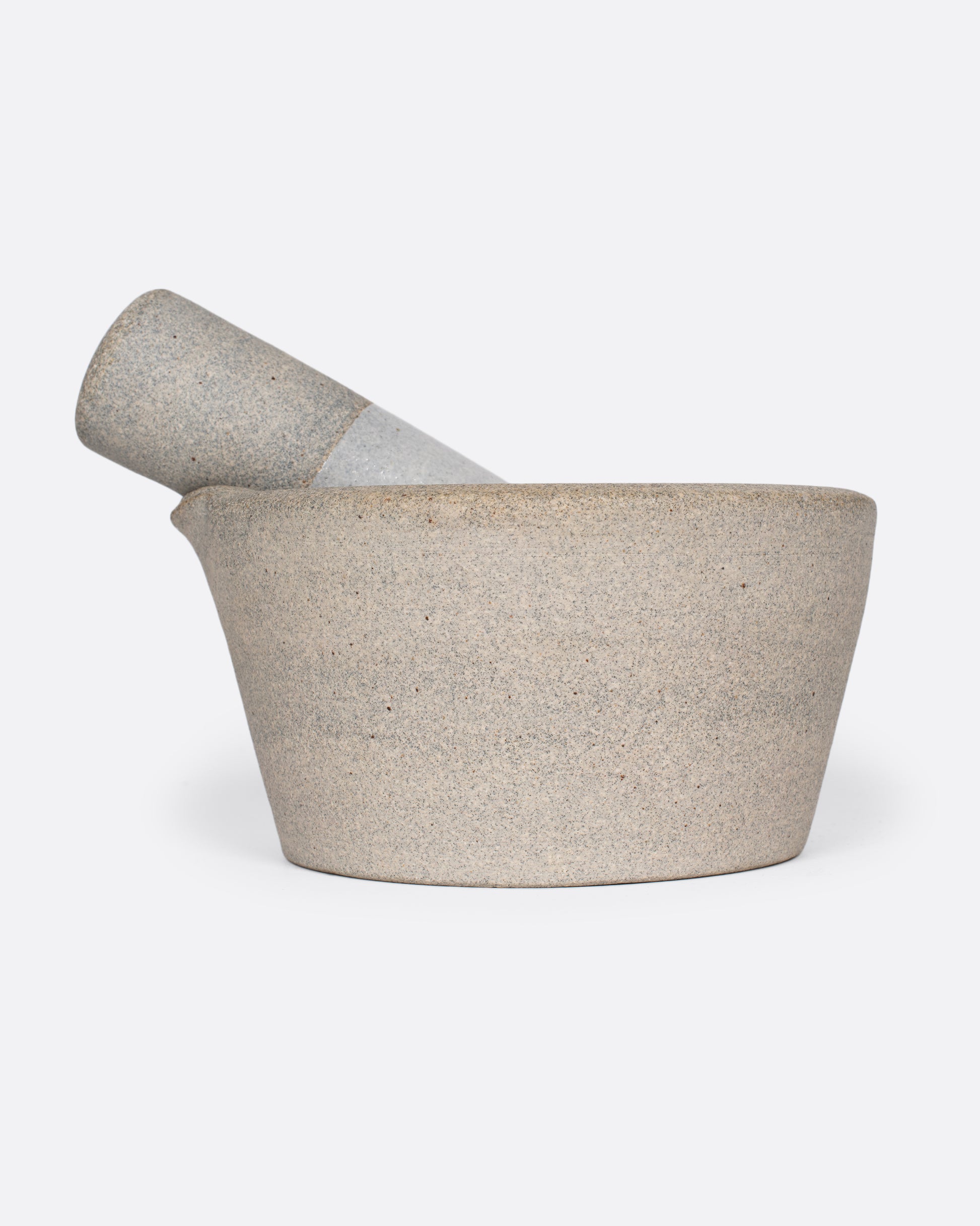 Broad-rimmed and heavy, this mortar and pestle is both beautiful and highly functional, easy to clean and stain-resistant.