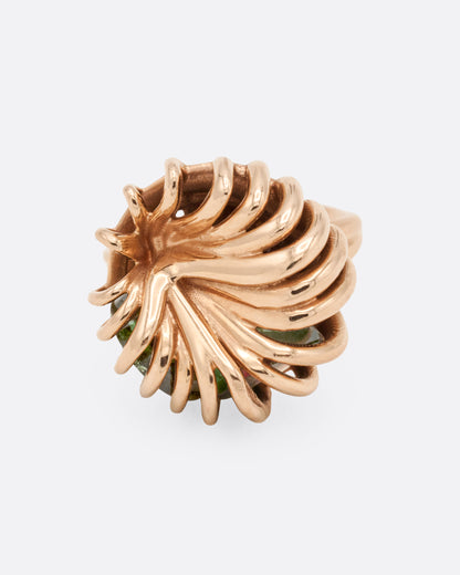 Rose gold swirl cage ring with emerald and tourmaline, top view of the wires swirling in to the center
