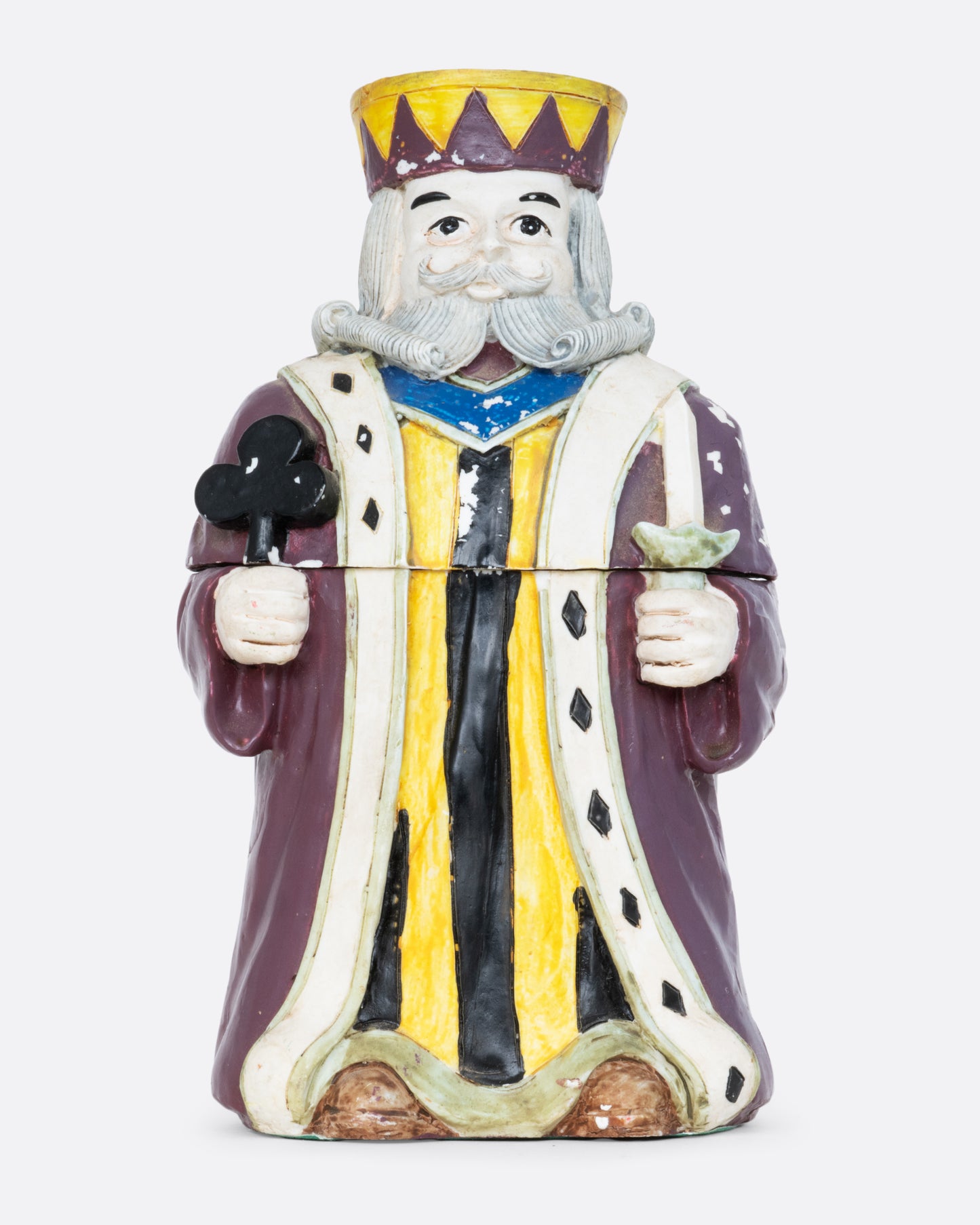 A card holder king of clubs figurine with a purple robe and crown, shown from the front.