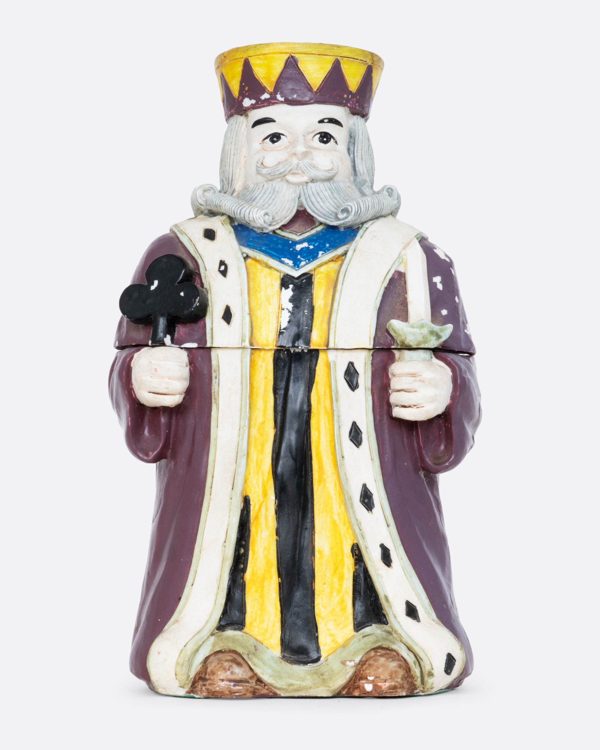 A card holder king of clubs figurine with a purple robe and crown, shown from the front.