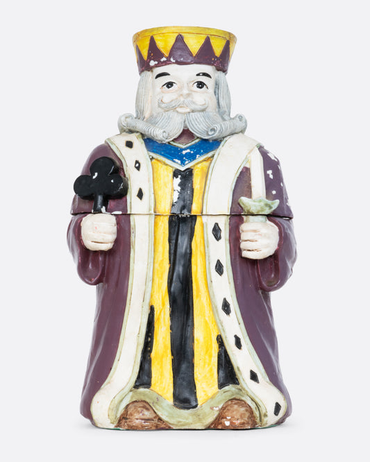 A card holder king of clubs figurine with a purple robe and crown, shown from the front.