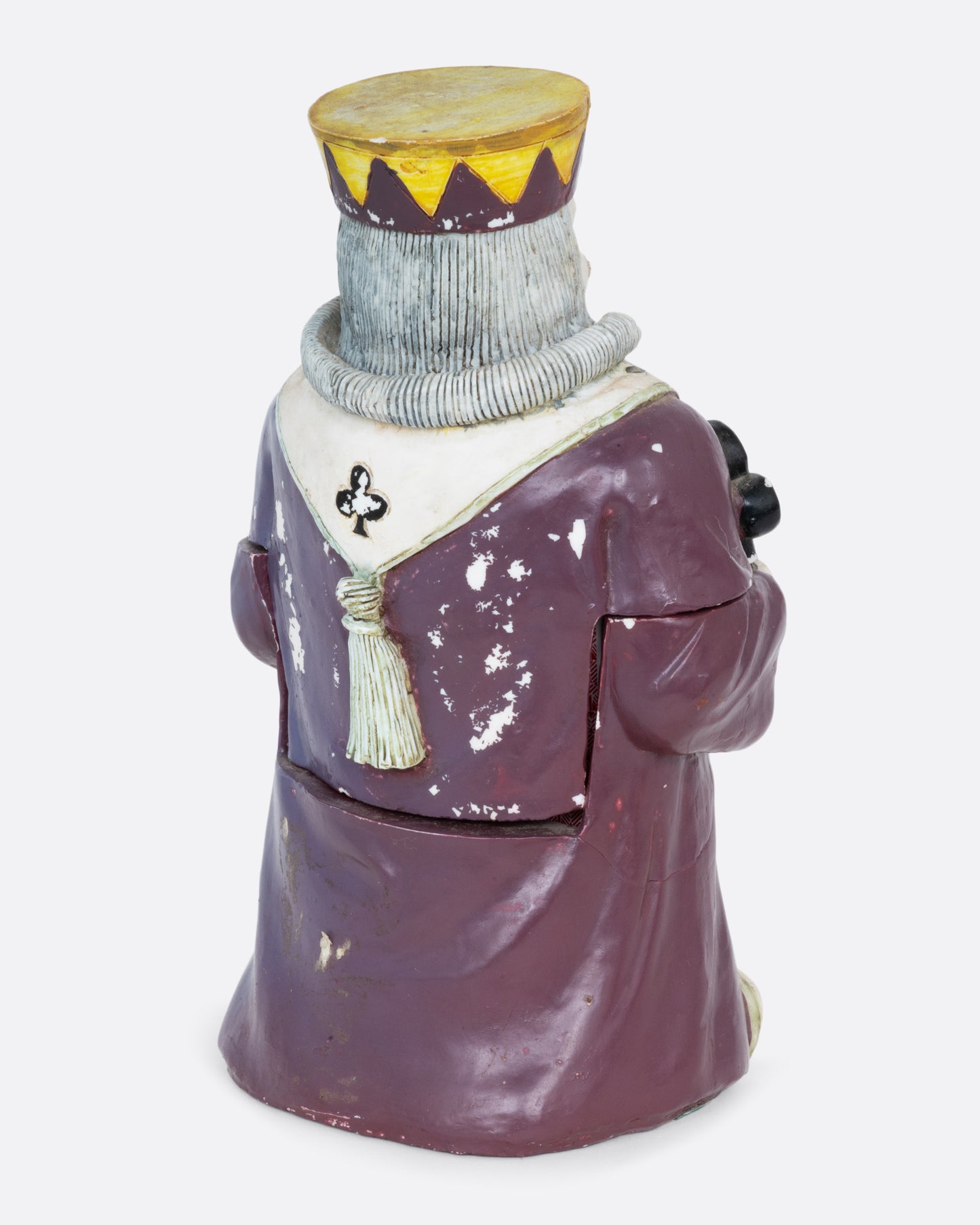 A card holder king of clubs figurine with a purple robe and crown, shown from the back.